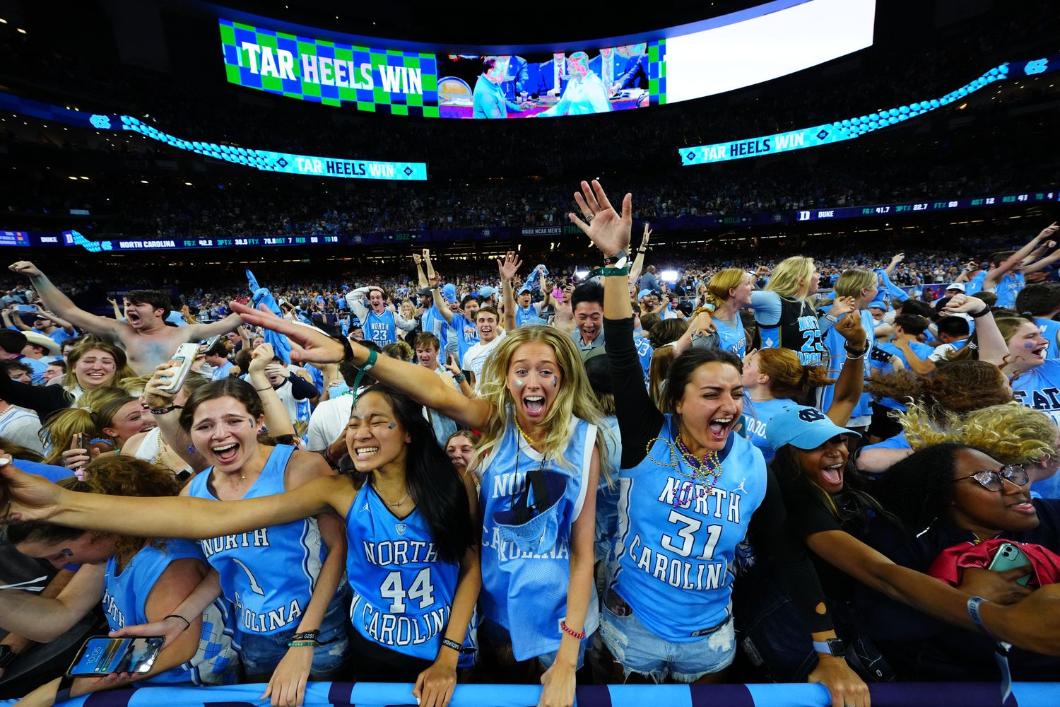 Apr 2, 2022; New Orleans, LA, USA; North Carolina Tar Heels fans celebrate after defeating the Duke Blue Devils during the 2022 NCAA men's basketball tournament Final Four semifinals at Caesars Superdome. Mandatory Credit: Andrew Wevers-USA TODAY Sports